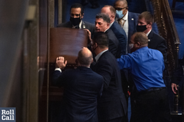 U.S. Rep. Andrew Clyde (R-GA) seen barricading doors to the House gallery on Jan. 6